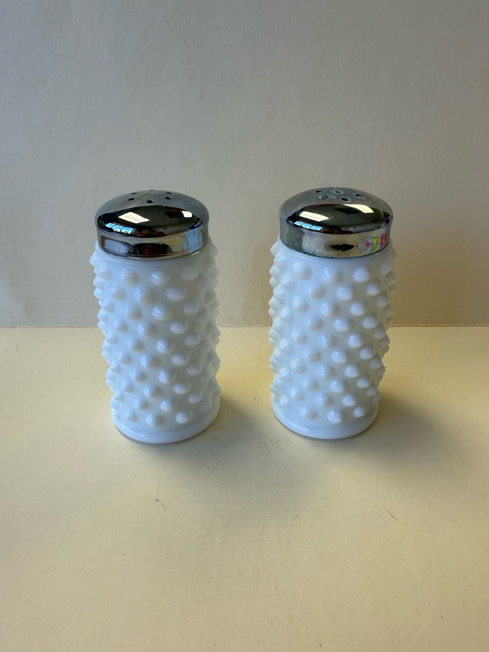 Vintage Fenton White Hobnail Glass Salt and Pepper Shakers with Silver Tops.